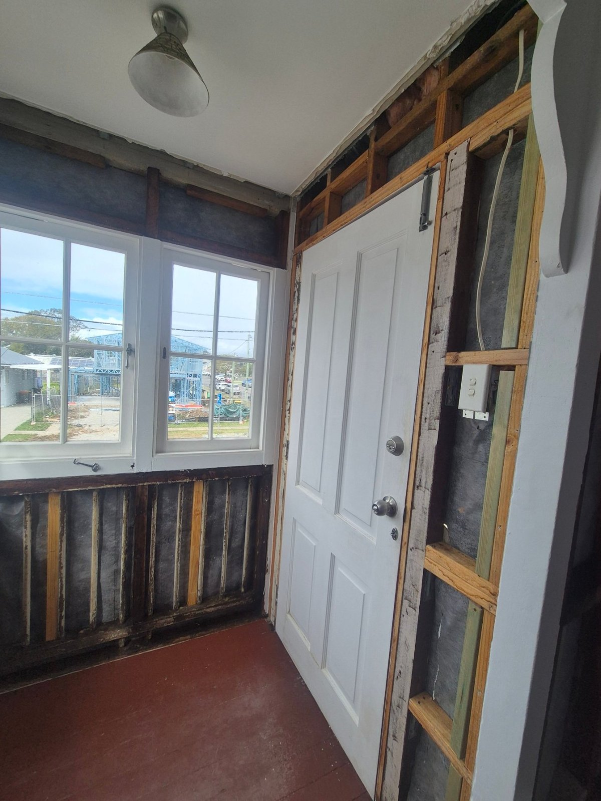 Little Demo asbestos strip-out in Caboolture — removed sheeting and exposed timber framing
