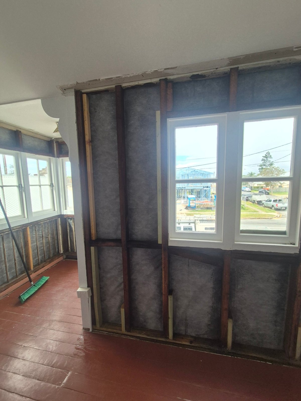 Room in a Deagon property with asbestos sheet lining and ceiling removed during a Class B strip-out