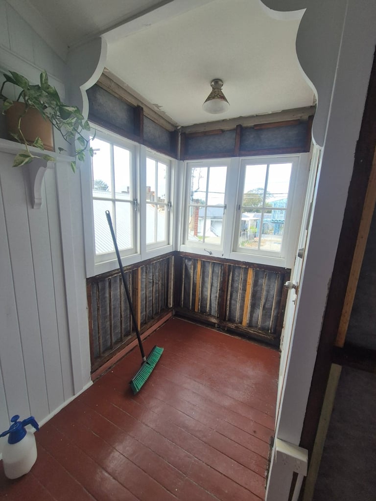 Enclosed sunroom in Deagon after asbestos sheet panels were removed, ready for new linings